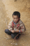 Hmong Boy Winding Top