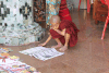 Young Monk Reading Newspaper